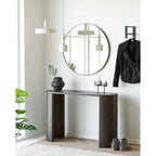 Vase verre noir mat soufflé bouche sur console bois foncé entrée miroir rond