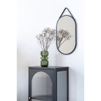 Vitrine Adelaide noire styled vase vert miroir ovale entrée